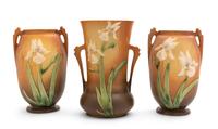 Three Roseville Iris Pottery Vases Height of first 10 1/4 inches, pair 9 1/2 inches.