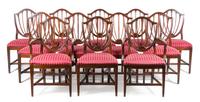 A Set of Twelve Hepplewhite Style Mahogany Dining Chairs Height 38 inches. — 20TH CENTURY