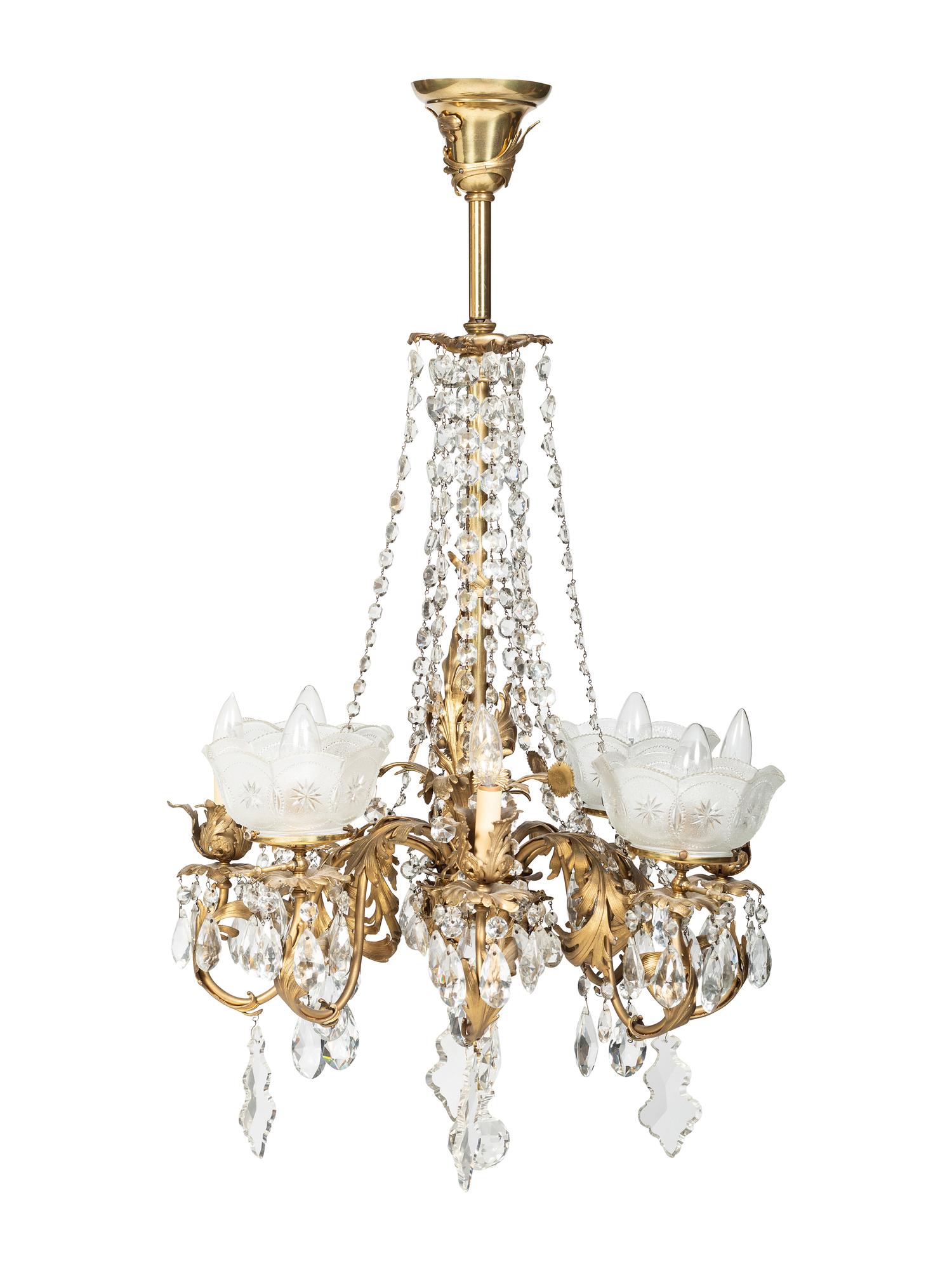 A Gilt Metal Eight Light Chandelier with Etched Glass Shades