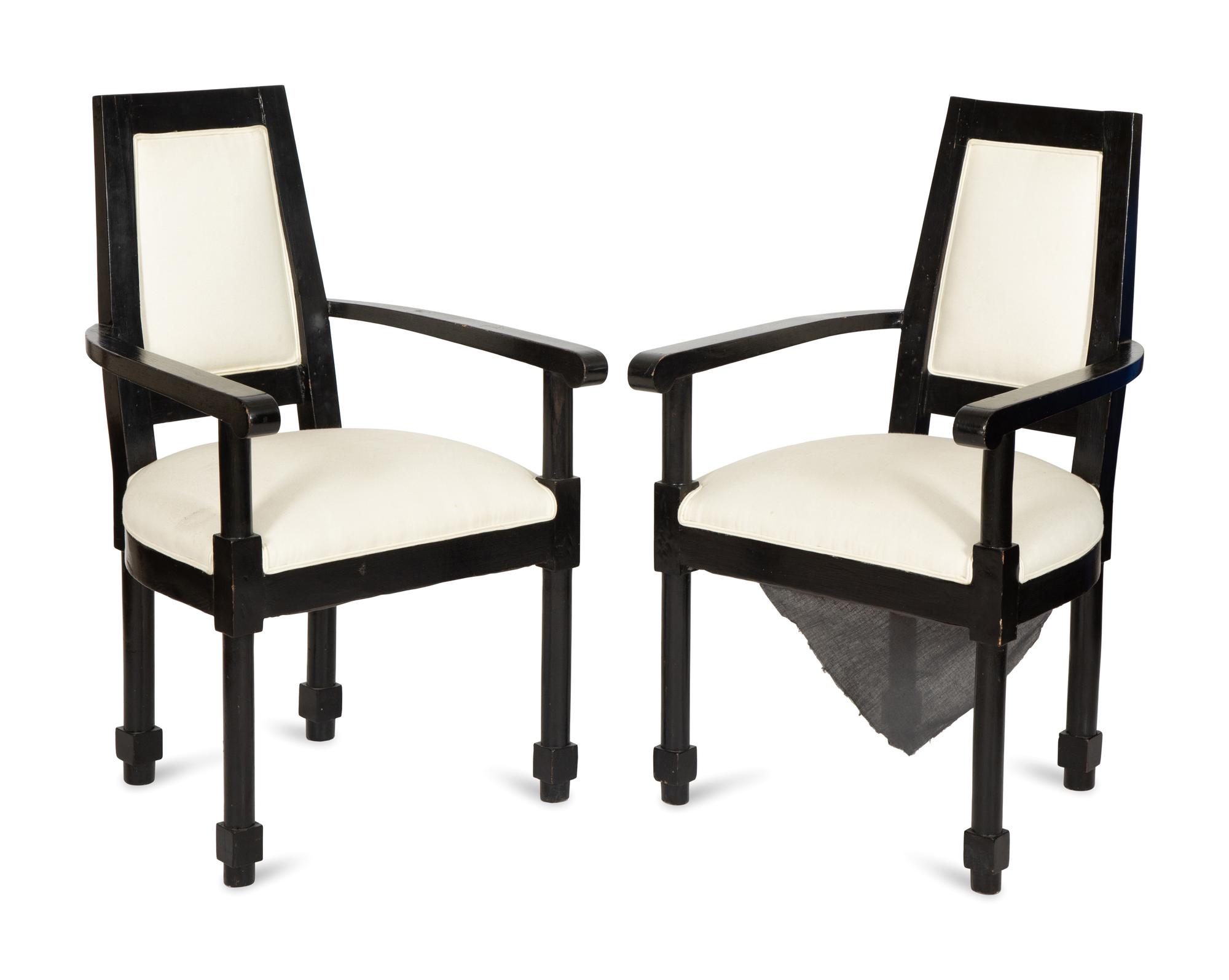A Pair of Continental Ebonized Armchairs