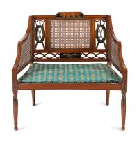 An Edwardian Painted and Caned Armchair