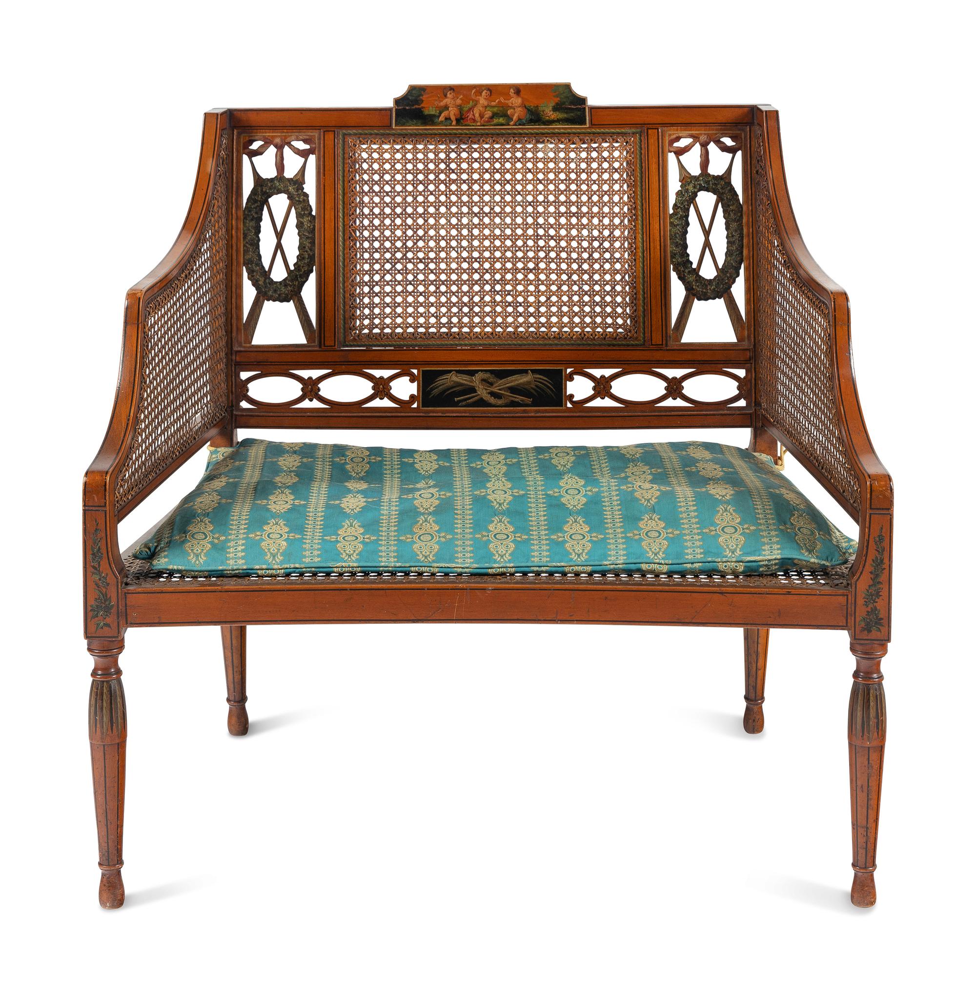 An Edwardian Painted and Caned Armchair