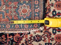 A Persian Senneh Wool Rug