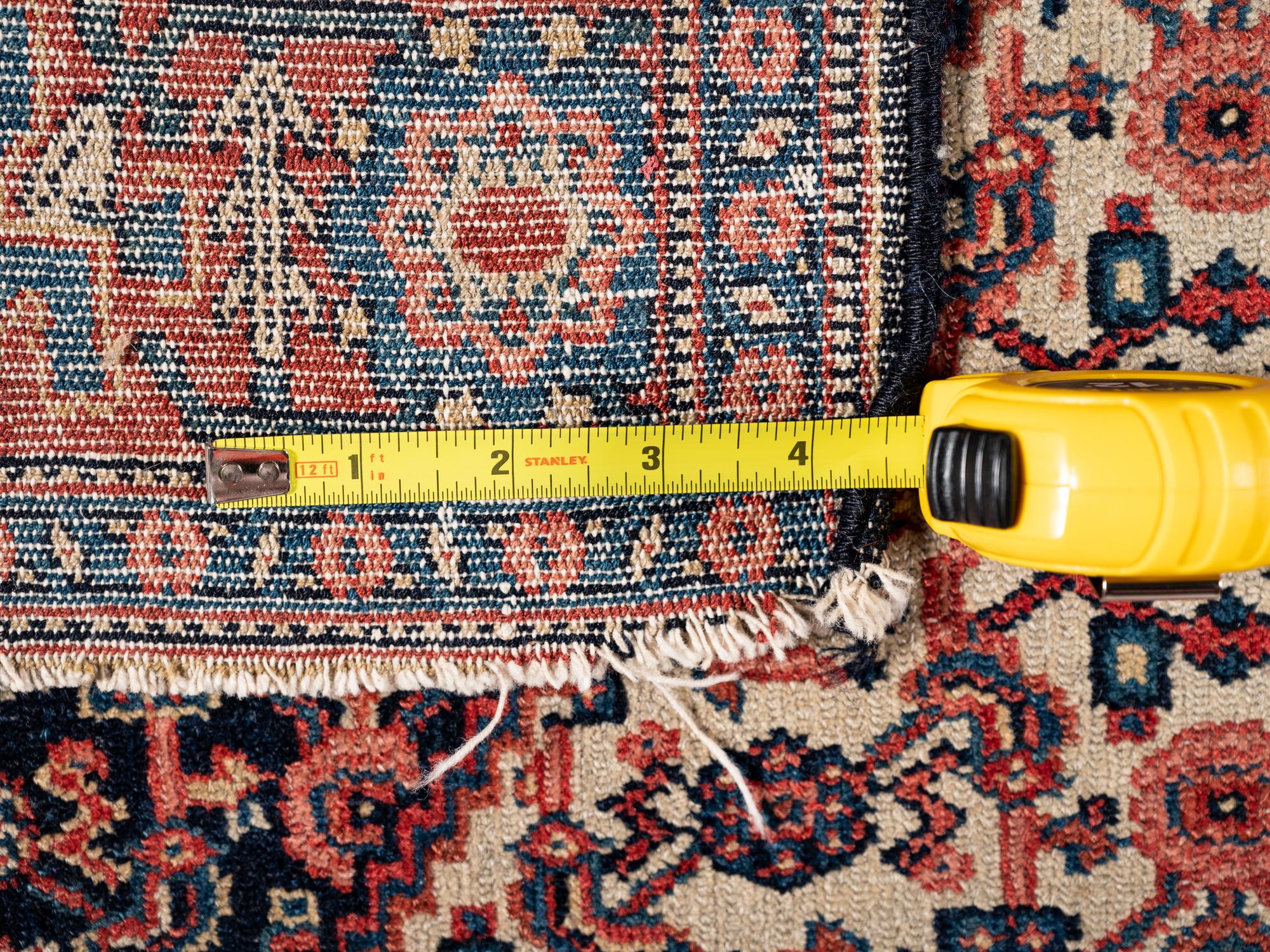 A Persian Senneh Wool Rug