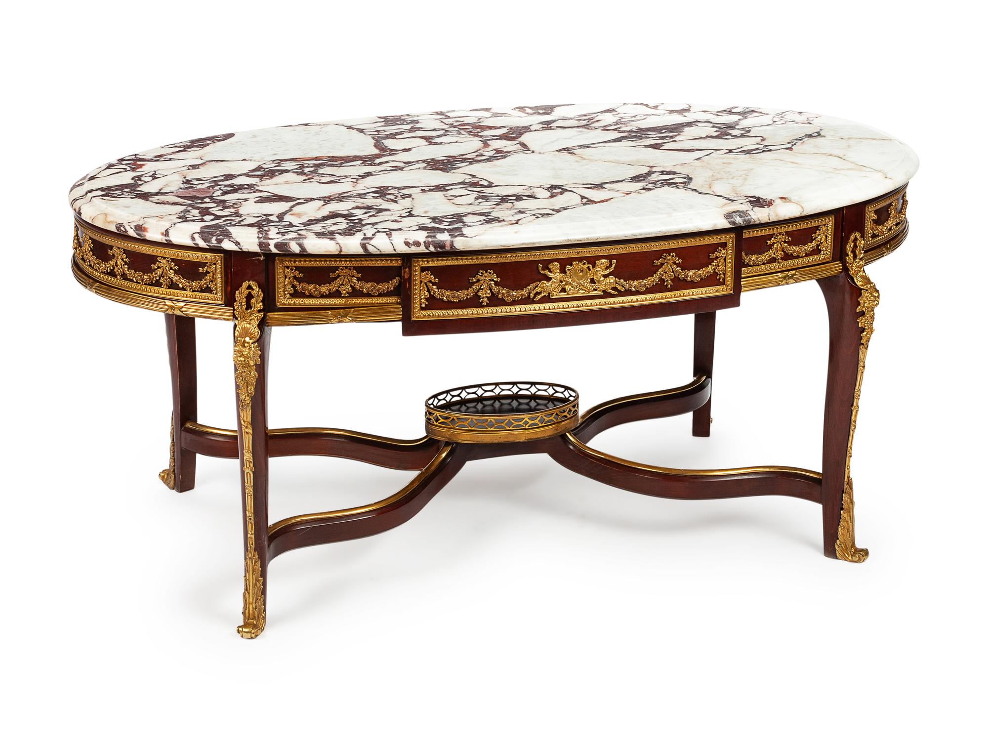 A Louis XV Style Gilt Bronze Mounted Mahogany Table