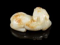 A Pale Celadon and Russet Jade Figure of a Mythical Beast Length 3 1/4 inches. — 19TH CENTURY