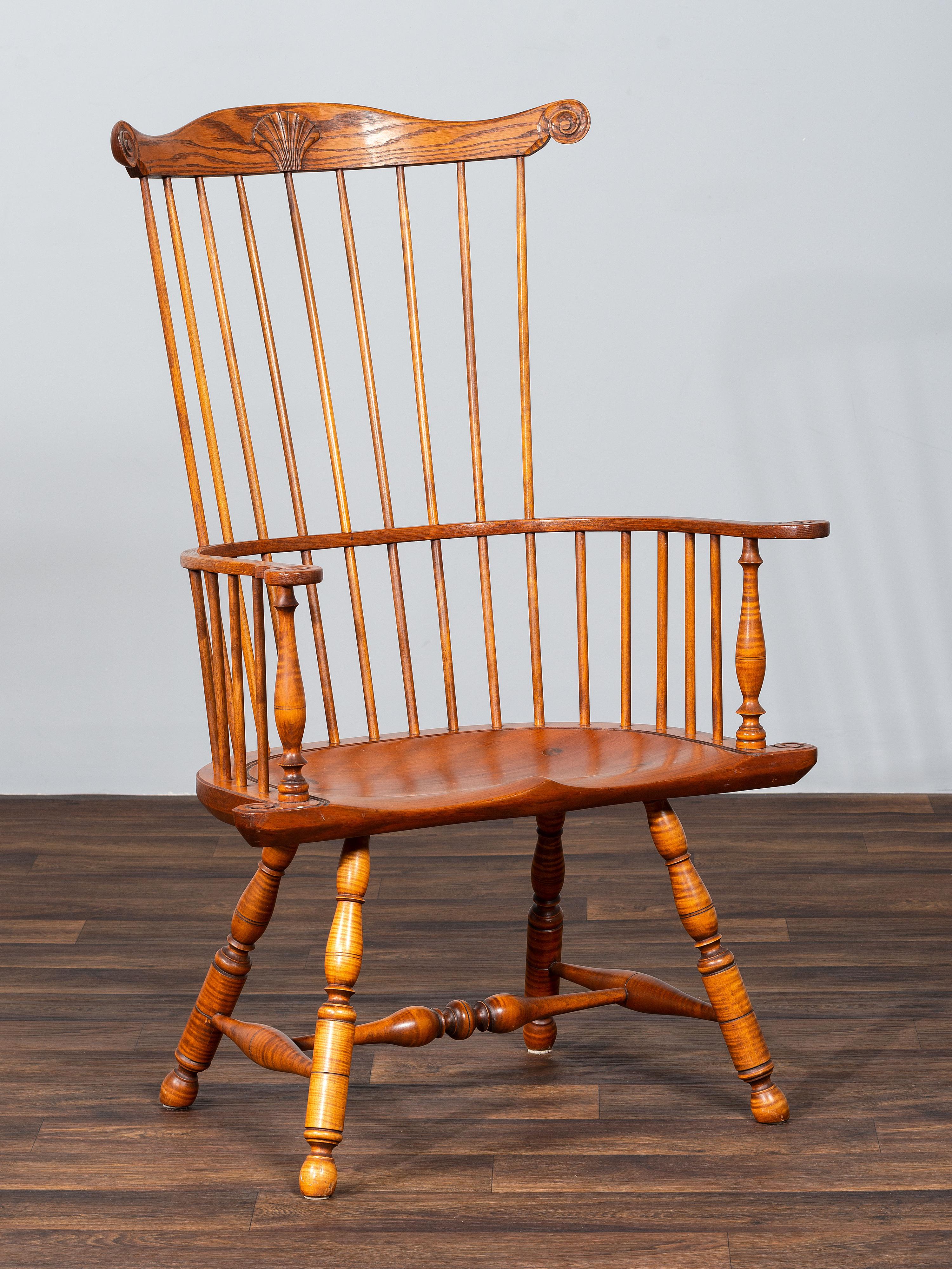 A D.R. Dimes Benchmark Turned and Volute Carved Tiger Maple and Pine Comb-Back Windsor Armchair