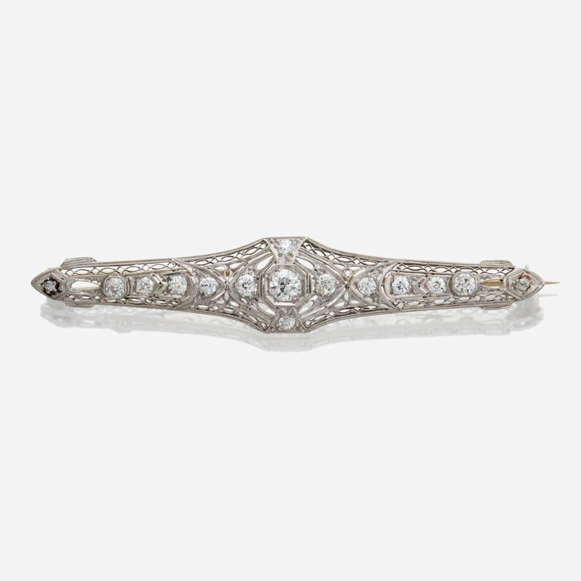 A white gold and diamond brooch