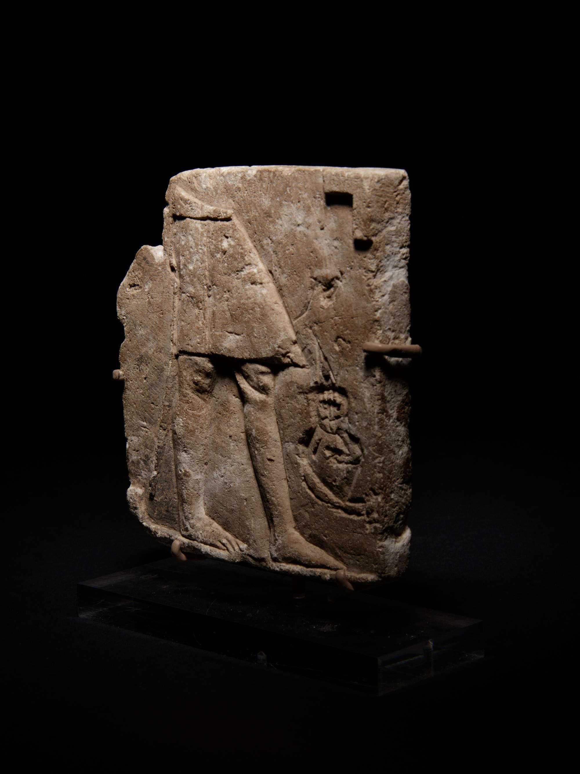 An Egyptian Limestone Sculptor's Model or Votive Relief