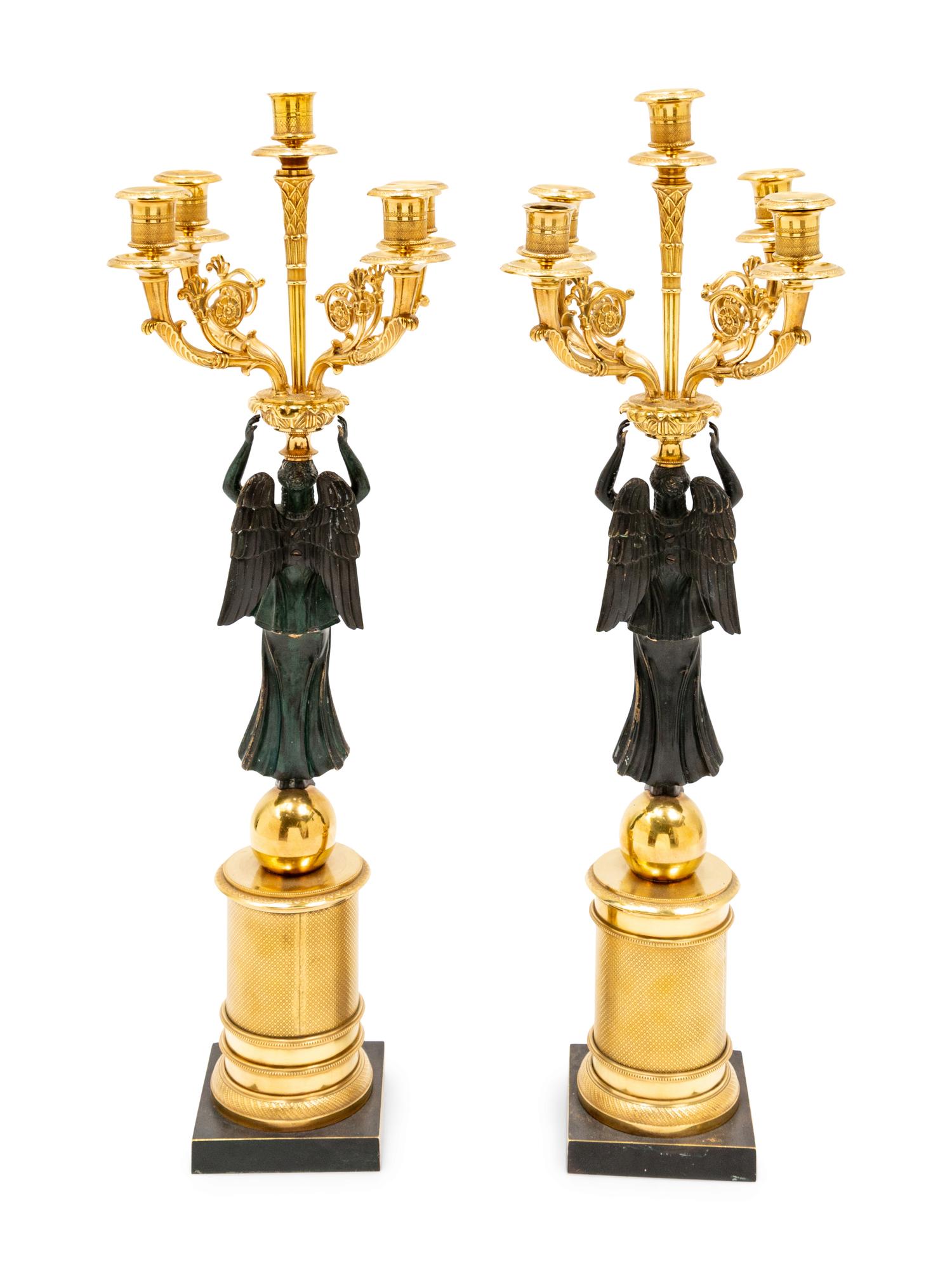 A Pair of Empire Style Gilt and Patinated Bronze Figural Candelabra