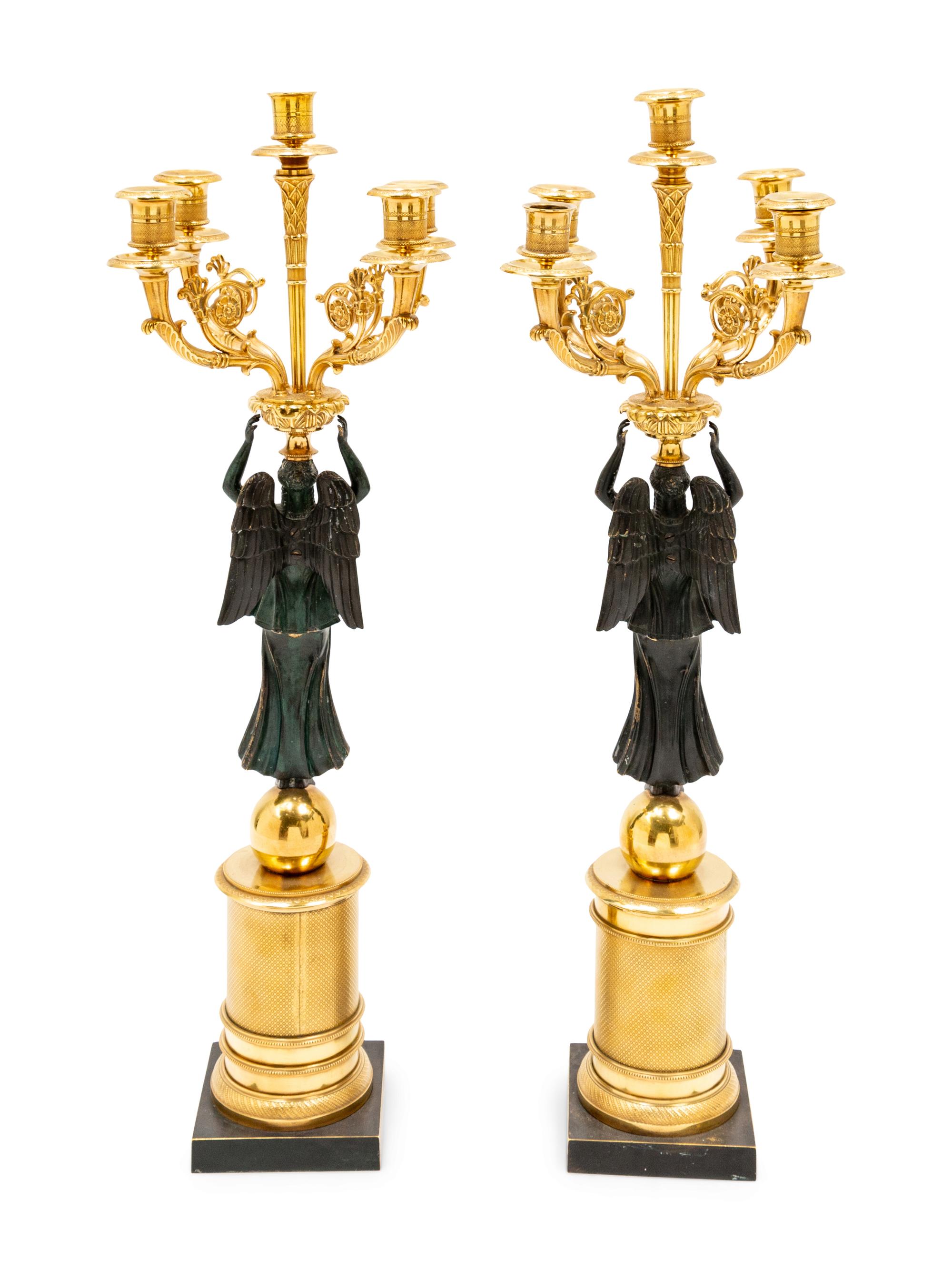 A Pair of Empire Style Gilt and Patinated Bronze Figural Candelabra