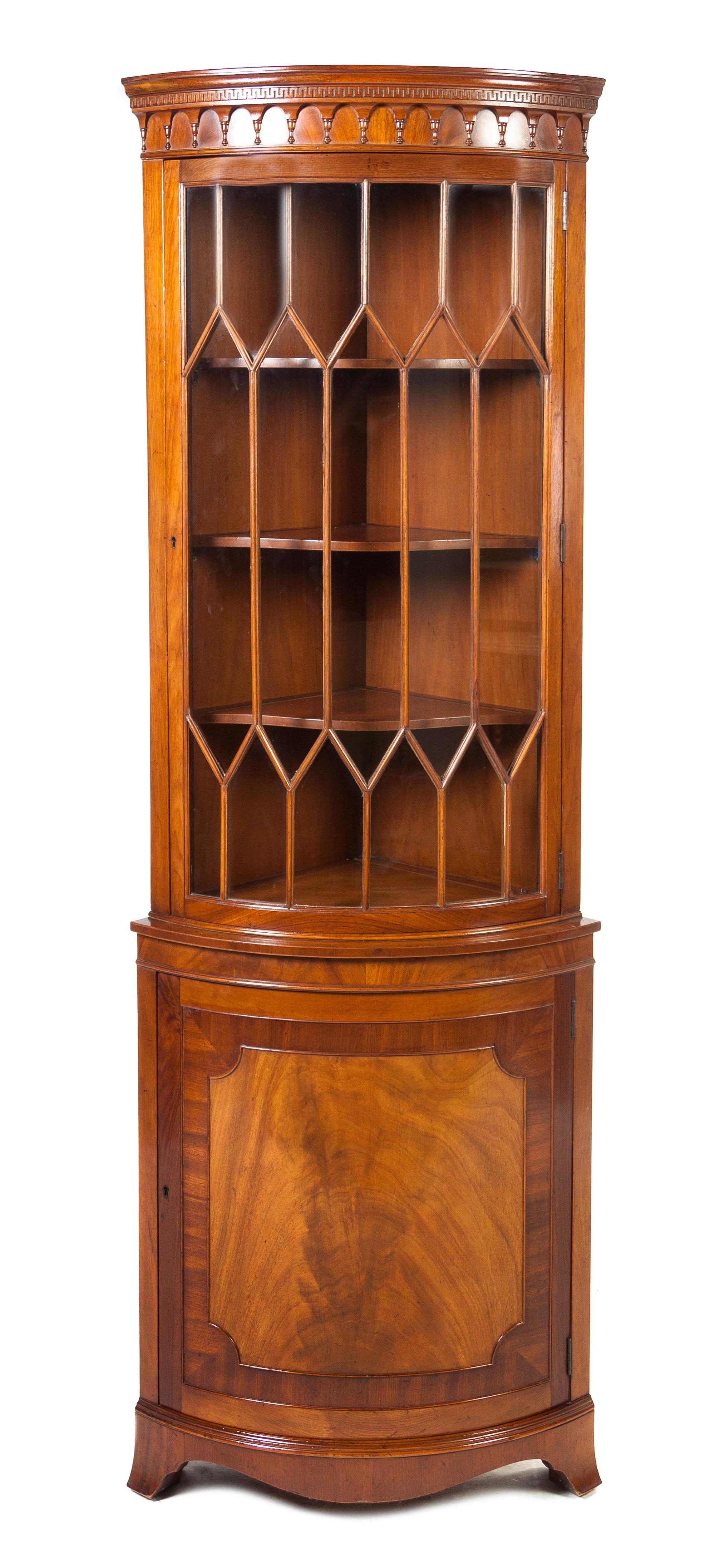 A George III Style Mahogany Corner Cabinet, Height 77 1/2 x width 27 x depth 17 1/4 inches.
