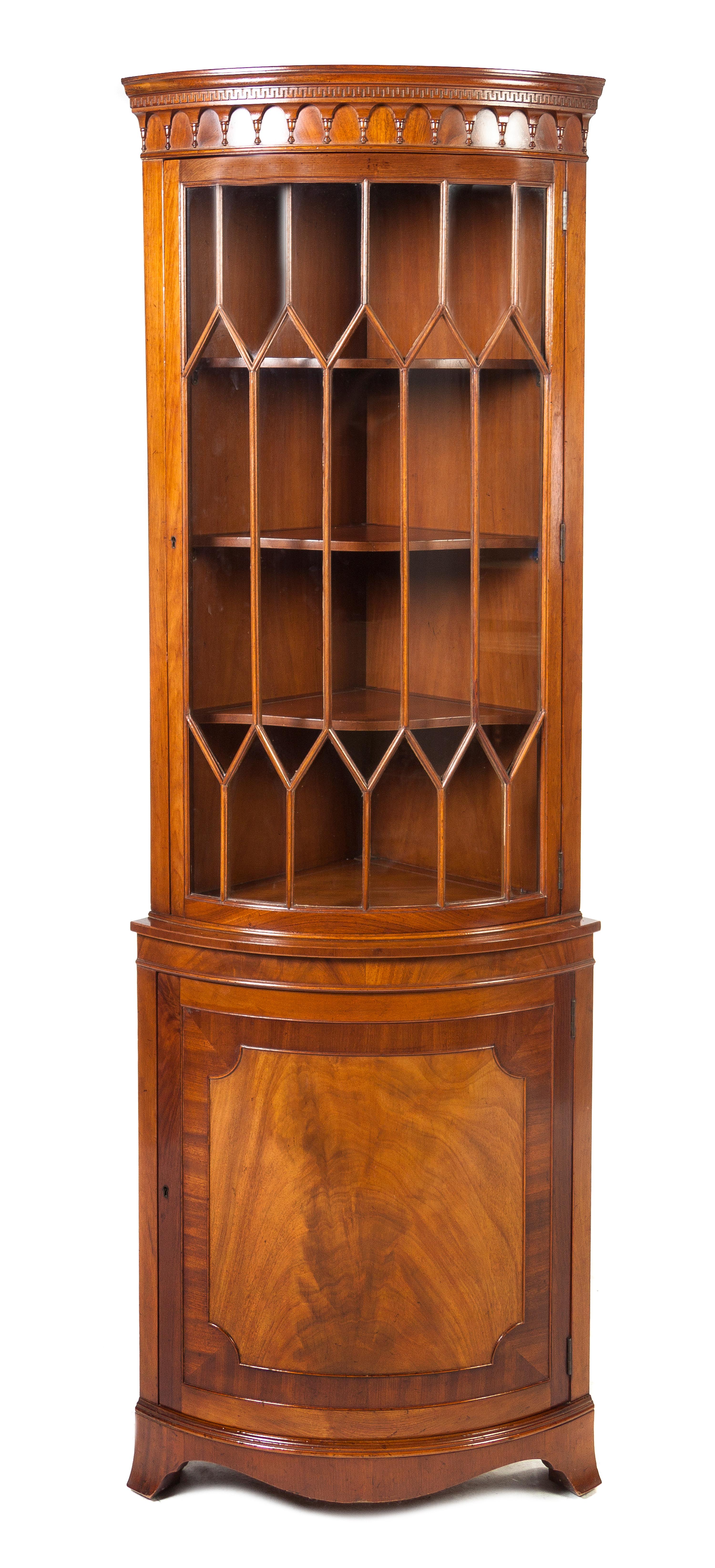 A George III Style Mahogany Corner Cabinet, Height 77 1/2 x width 27 x depth 17 1/4 inches.