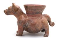 A Pre-Columbian Style Colima Dog-Form Vessel Height 11 x width 9 x depth 18 inches.