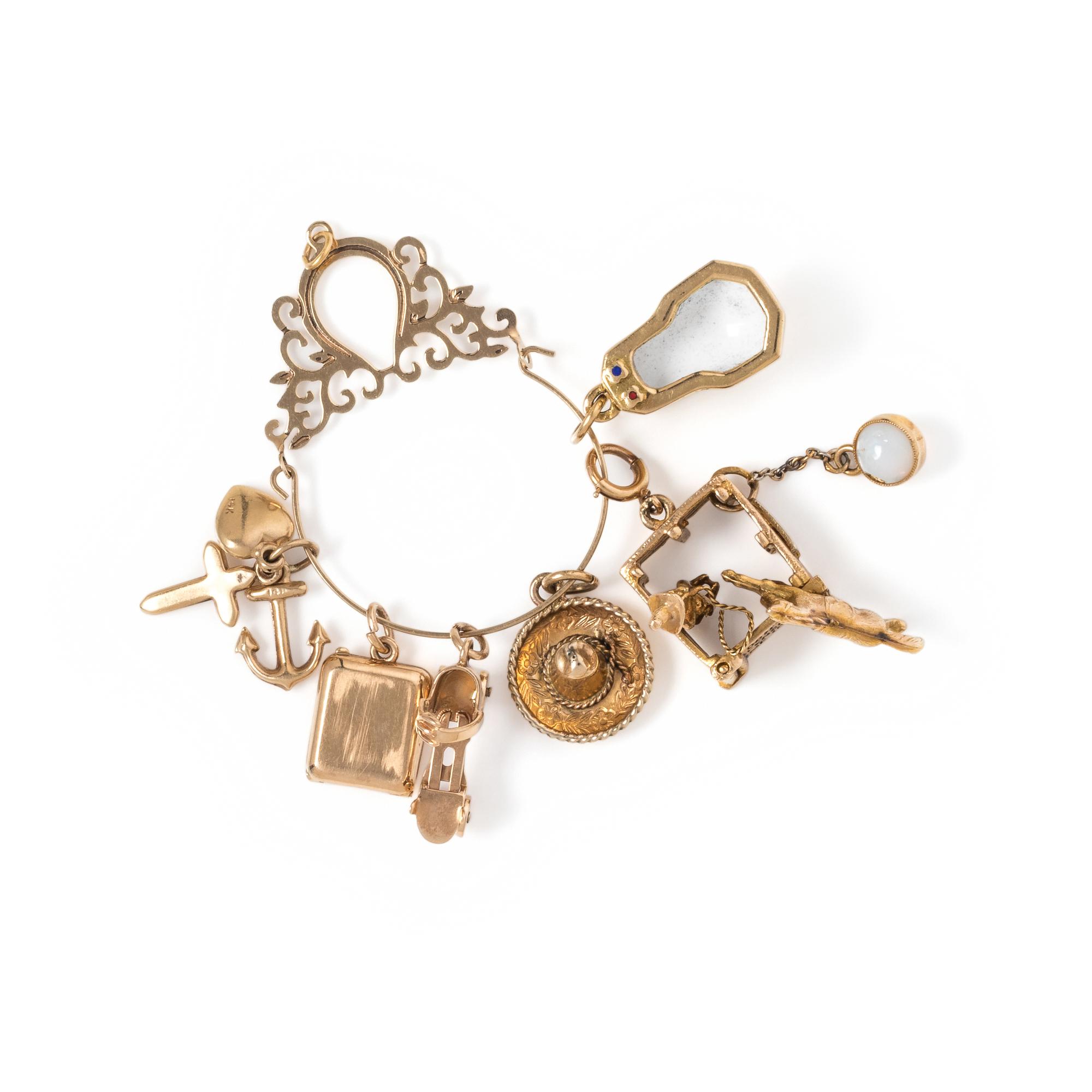 COLLECTION OF YELLOW GOLD CHARMS