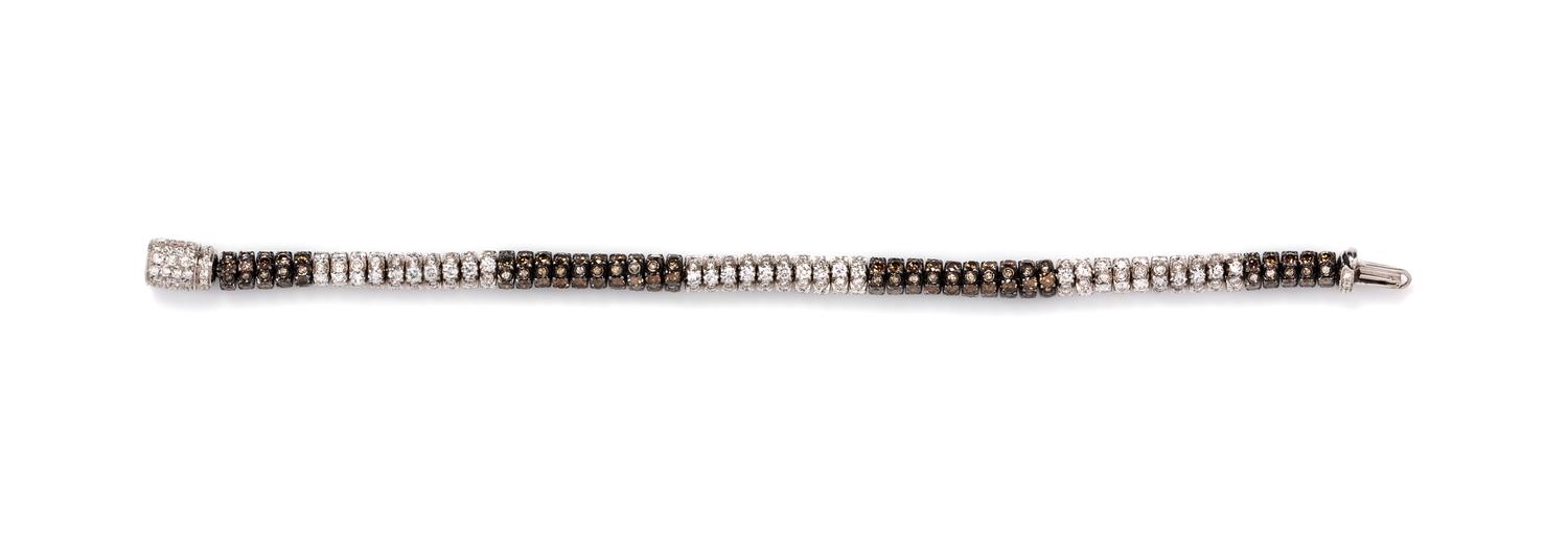 An 18 Karat White Gold, Colored Diamond and Diamond Bracelet, 18.00 dwts.