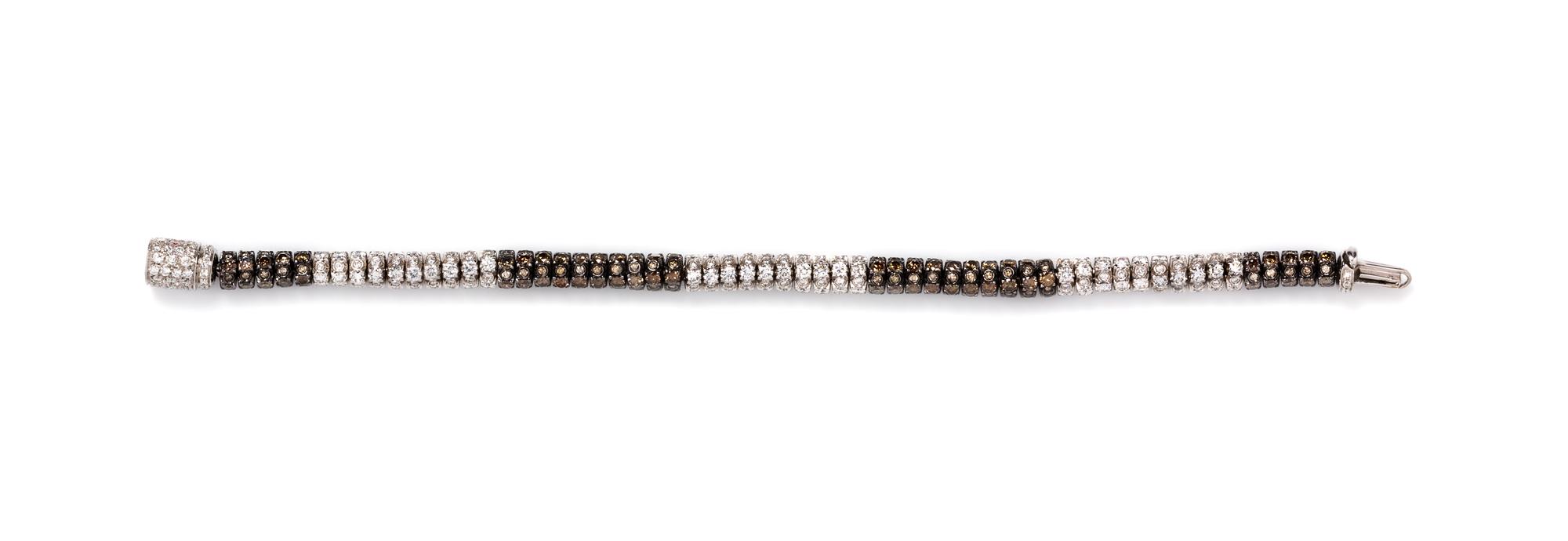 An 18 Karat White Gold, Colored Diamond and Diamond Bracelet, 18.00 dwts.