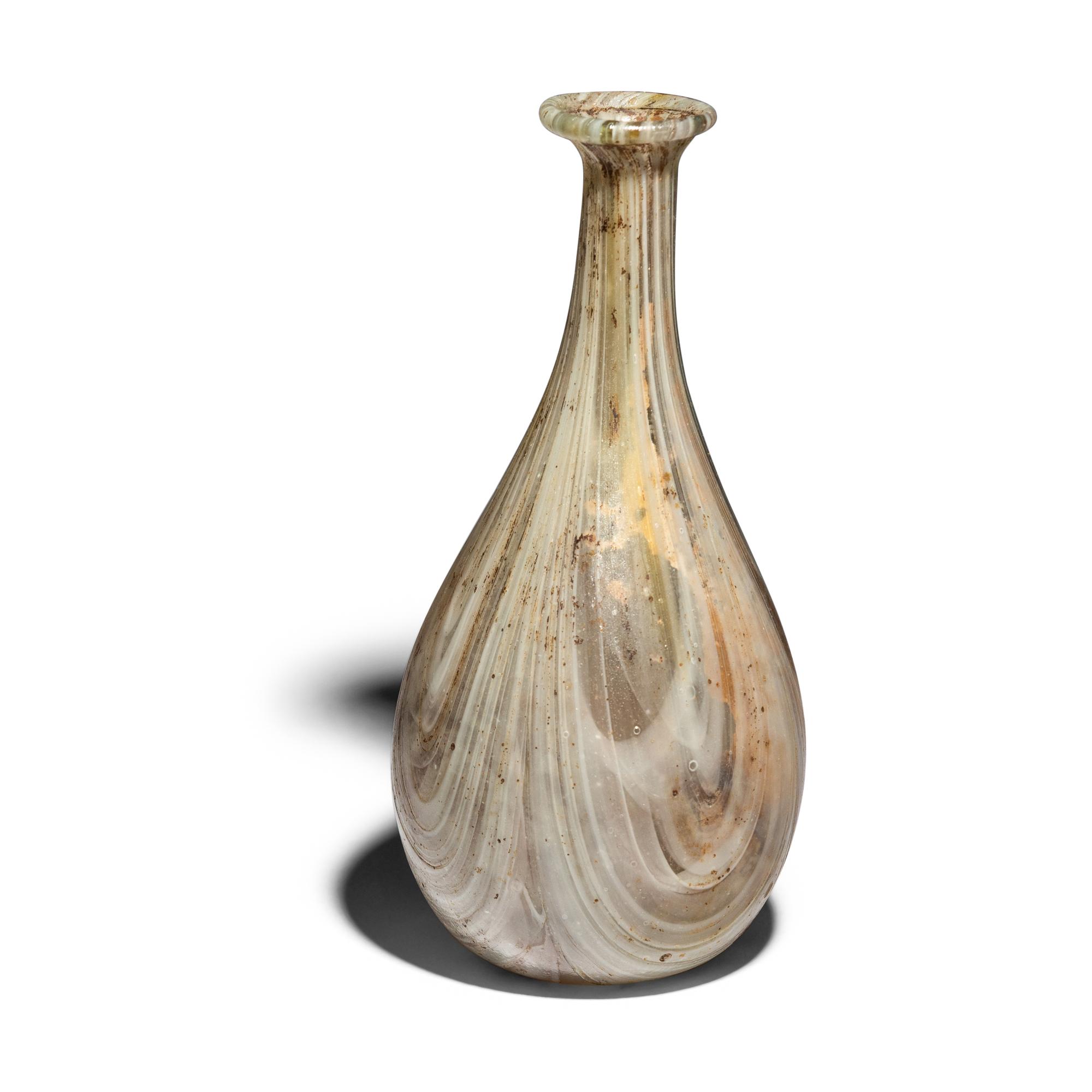 A Roman Marbled Pale Green and White Glass Bottle