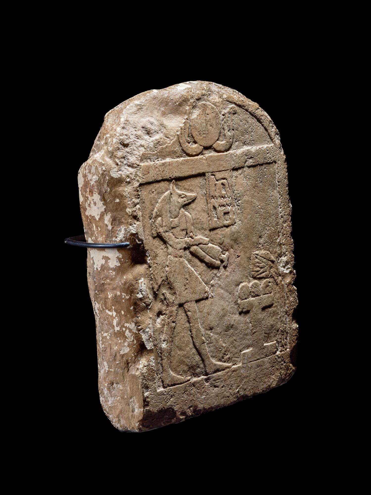 An Egyptian Limestone Round-Top Stele