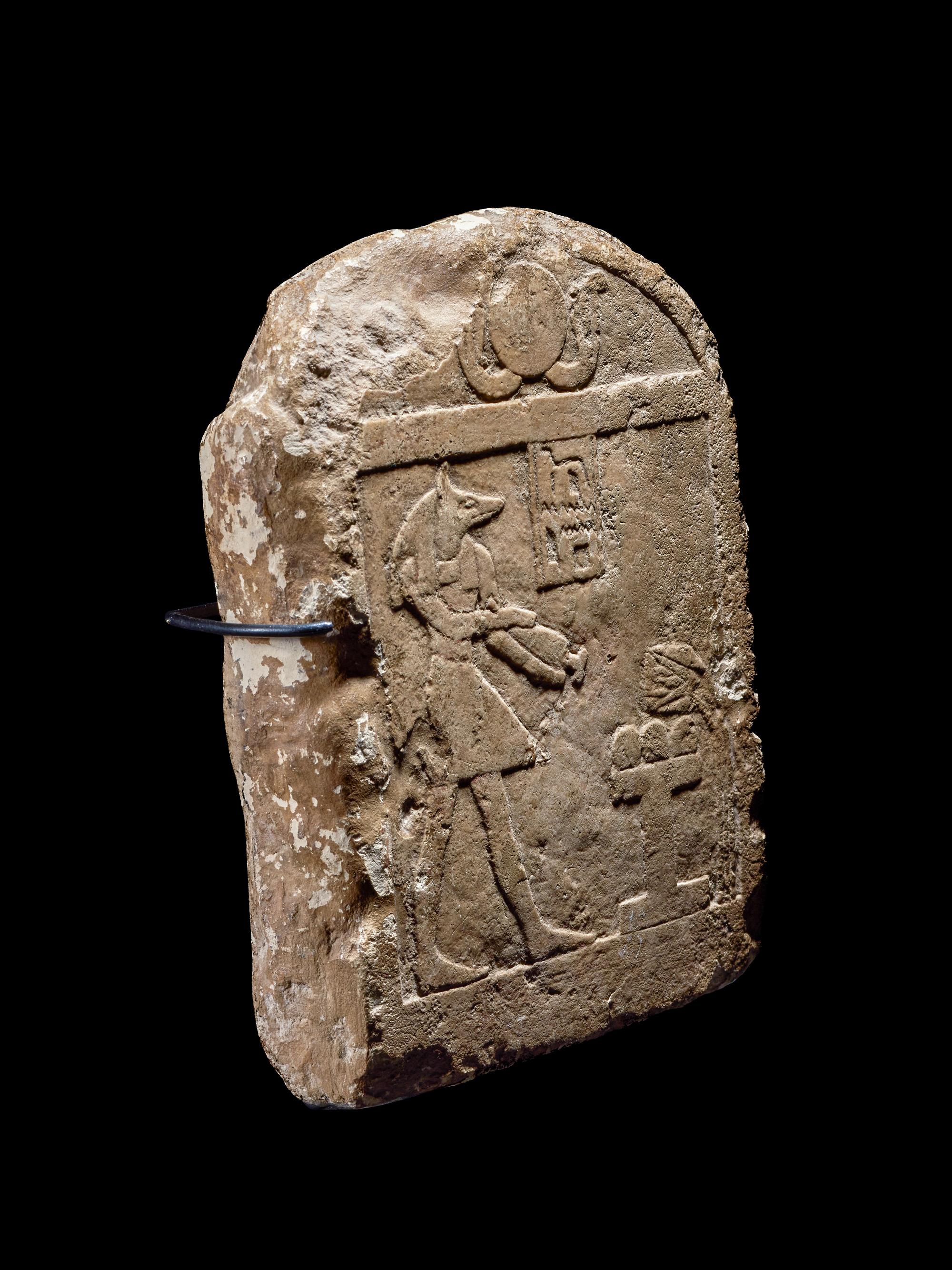 An Egyptian Limestone Round-Top Stele