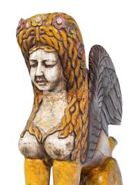 A Large Carved and Polychrome Decorated Wood Sphinx