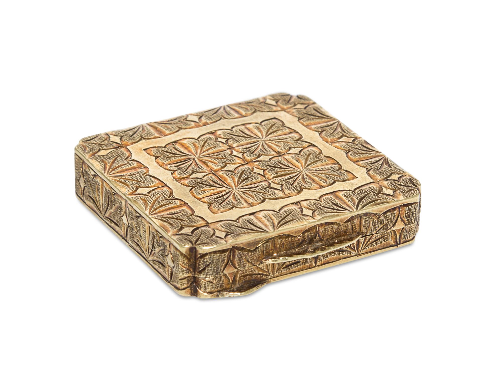 A 14 Karat Yellow Gold Compact, 20th Century, of square form with notched corners and mirrored interior.