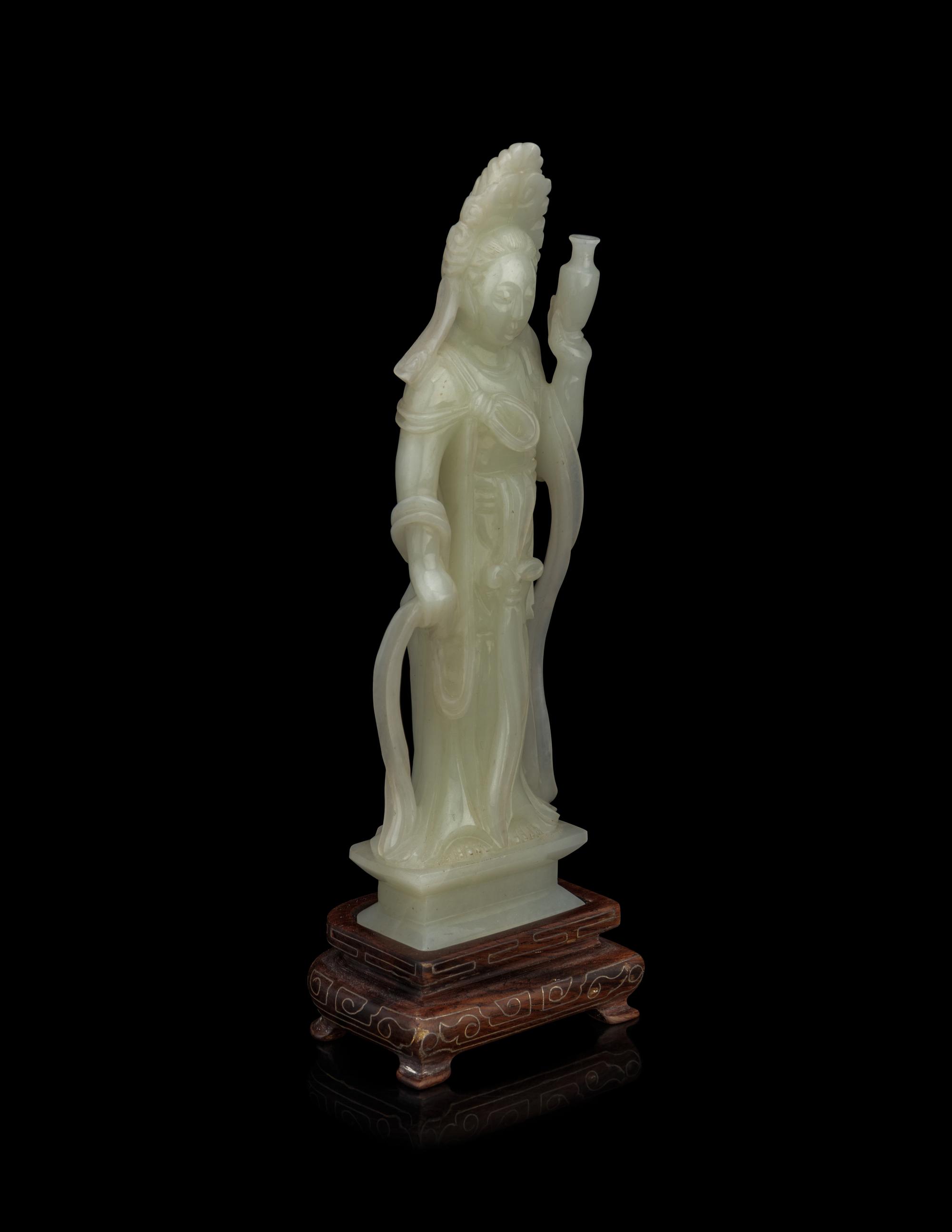 A Pale Celadon Jade Figure of Standing Guanyin