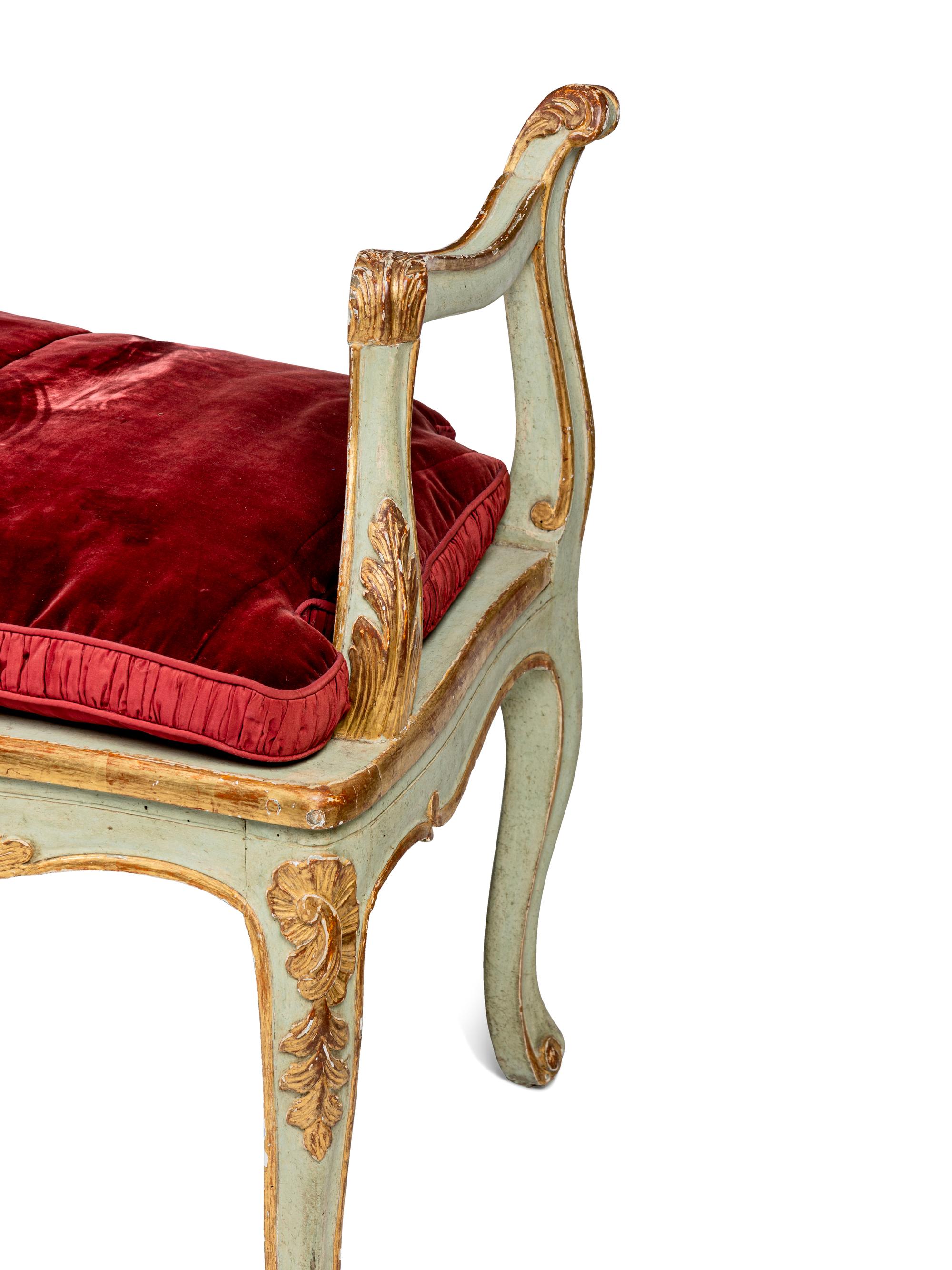 A Pair of Louis XV Green-Painted and Parcel-Gilt Cane Seat Window Benches