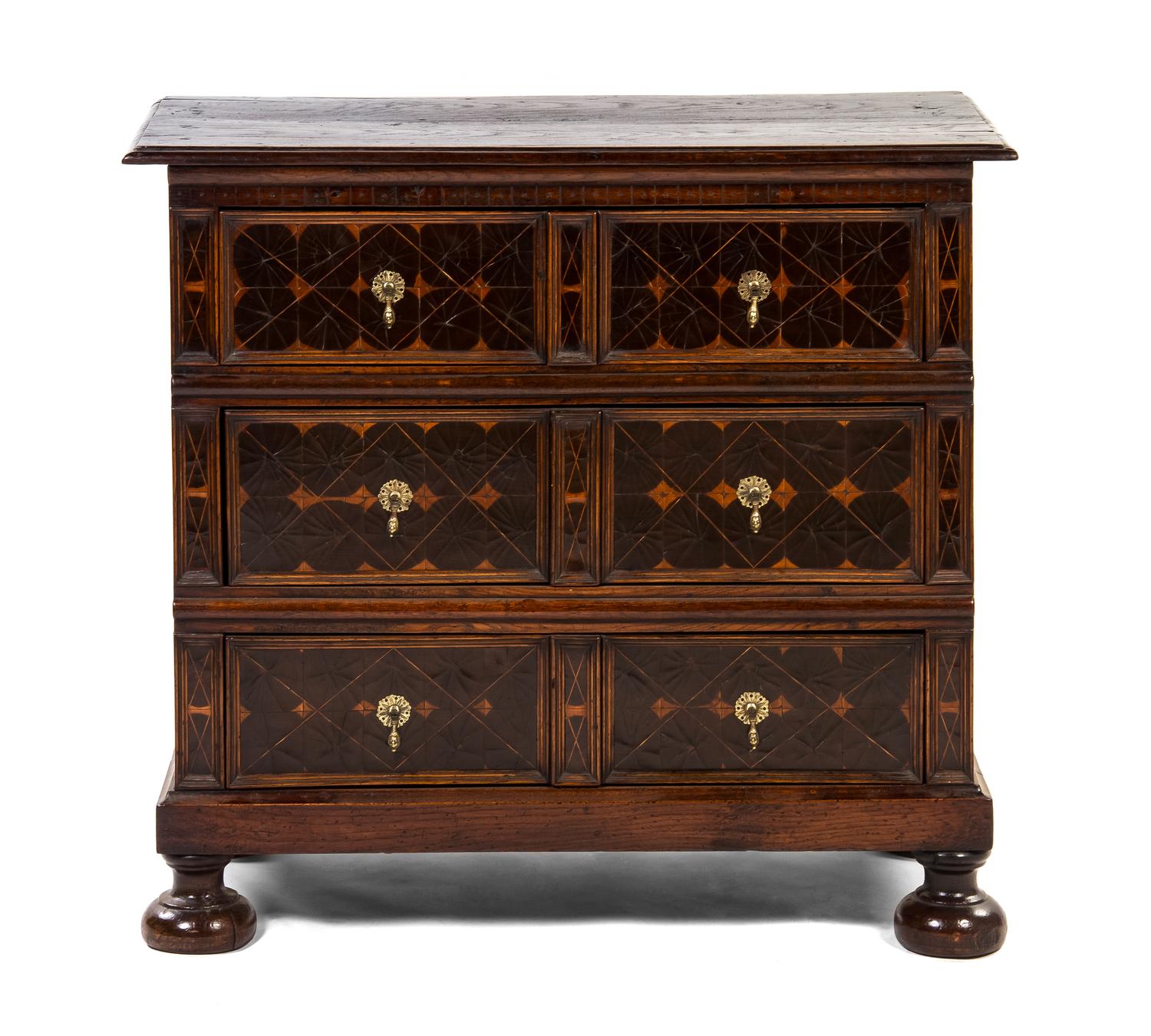 A Charles II Oak and Oyster Veneered Chest of Drawers, Height 36 1/4 x width 39 1/2 x depth 20 inches.