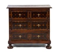 A Charles II Oak and Oyster Veneered Chest of Drawers, Height 36 1/4 x width 39 1/2 x depth 20 inches.
