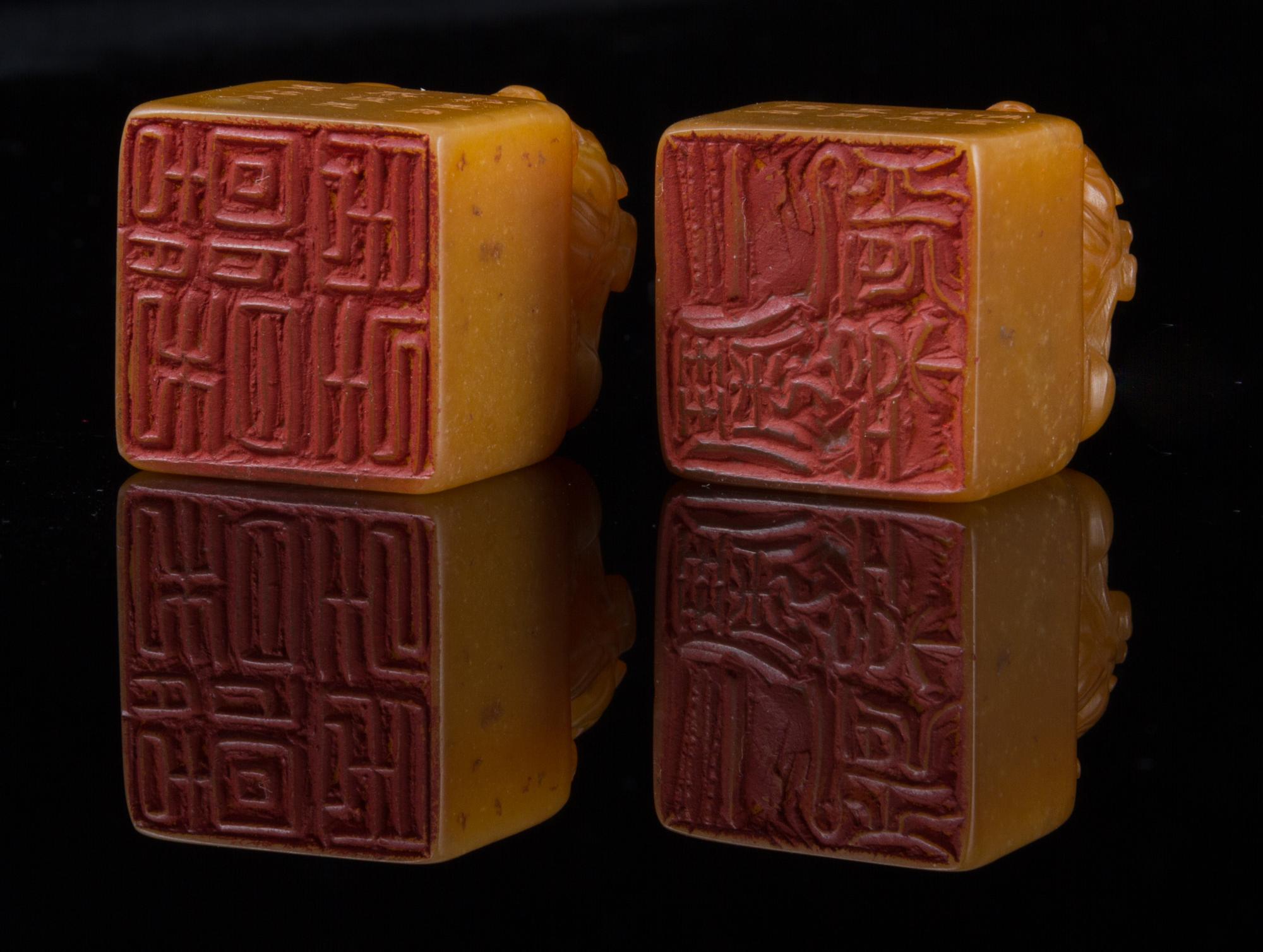 A Pair of Soapstone Seals Height of pair 1 5/8 inches.