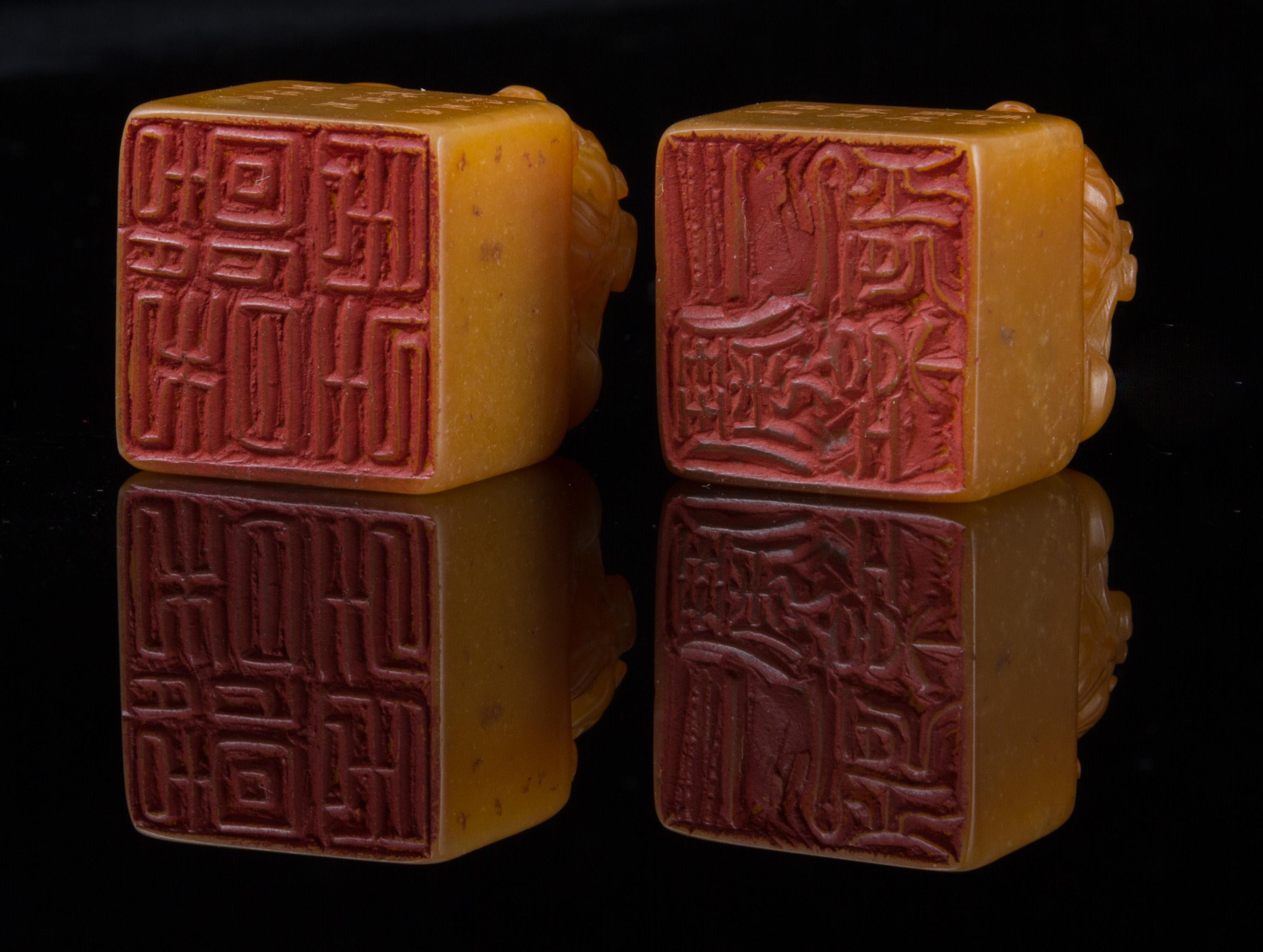 A Pair of Soapstone Seals Height of pair 1 5/8 inches.