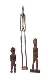 Three Carved Wood African Figures Height of tallest 58 3/4 inches.