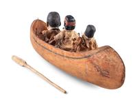 [ROOSEVELT, Theodore (1858-1919)]. Folk art canoe and figures representing Theodore Roosevelt's exploration of the River of Doubt during his expedition to Brazil in 1913-1914.