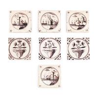 A Collection of Eight Delftware Manganese Decorated Tiles
