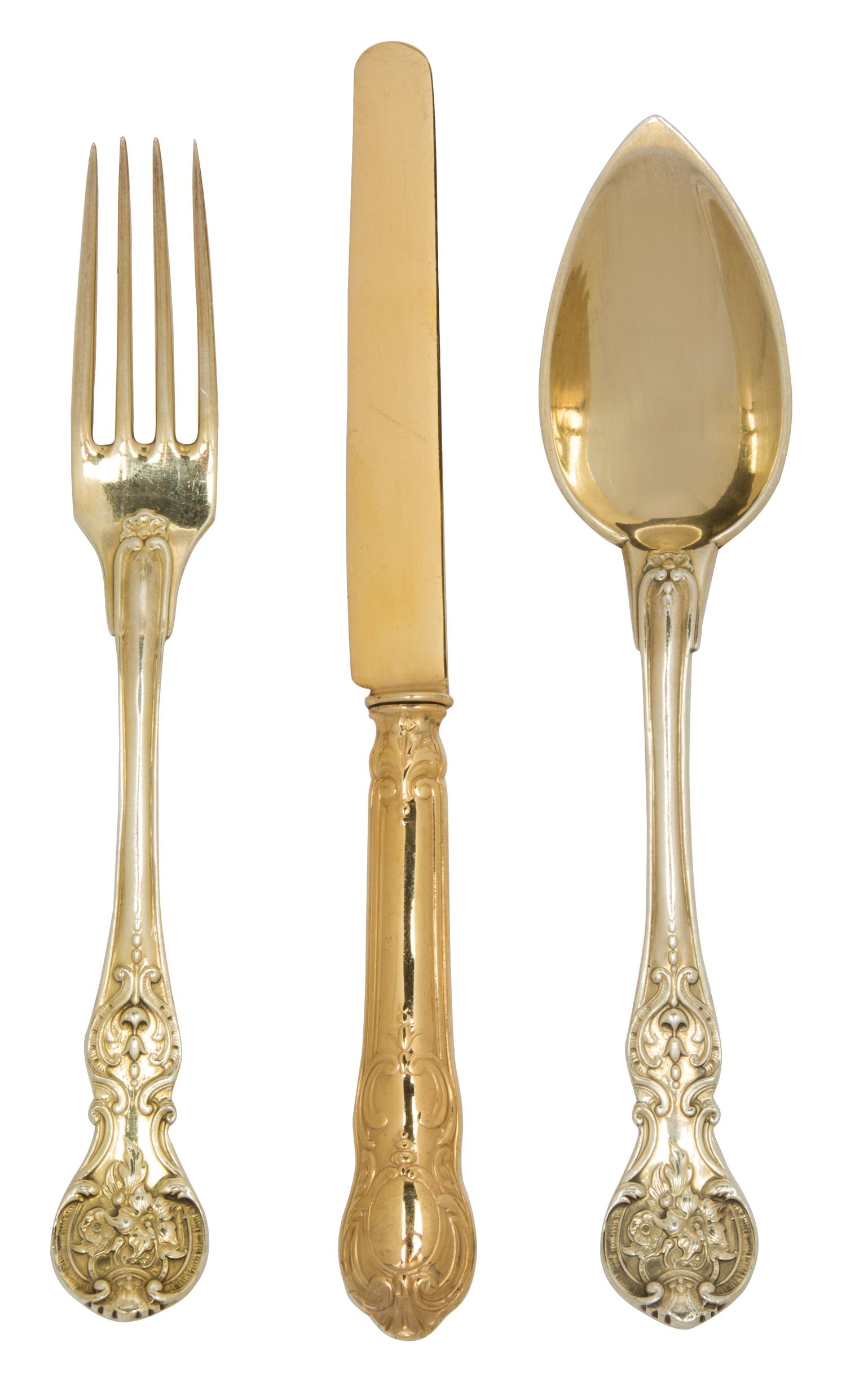 A Group of French Vermeil Silverplate Flatware, , comprising: 12 Christofle oval soup spoons 4 matching salad forks 18 fruit knives by