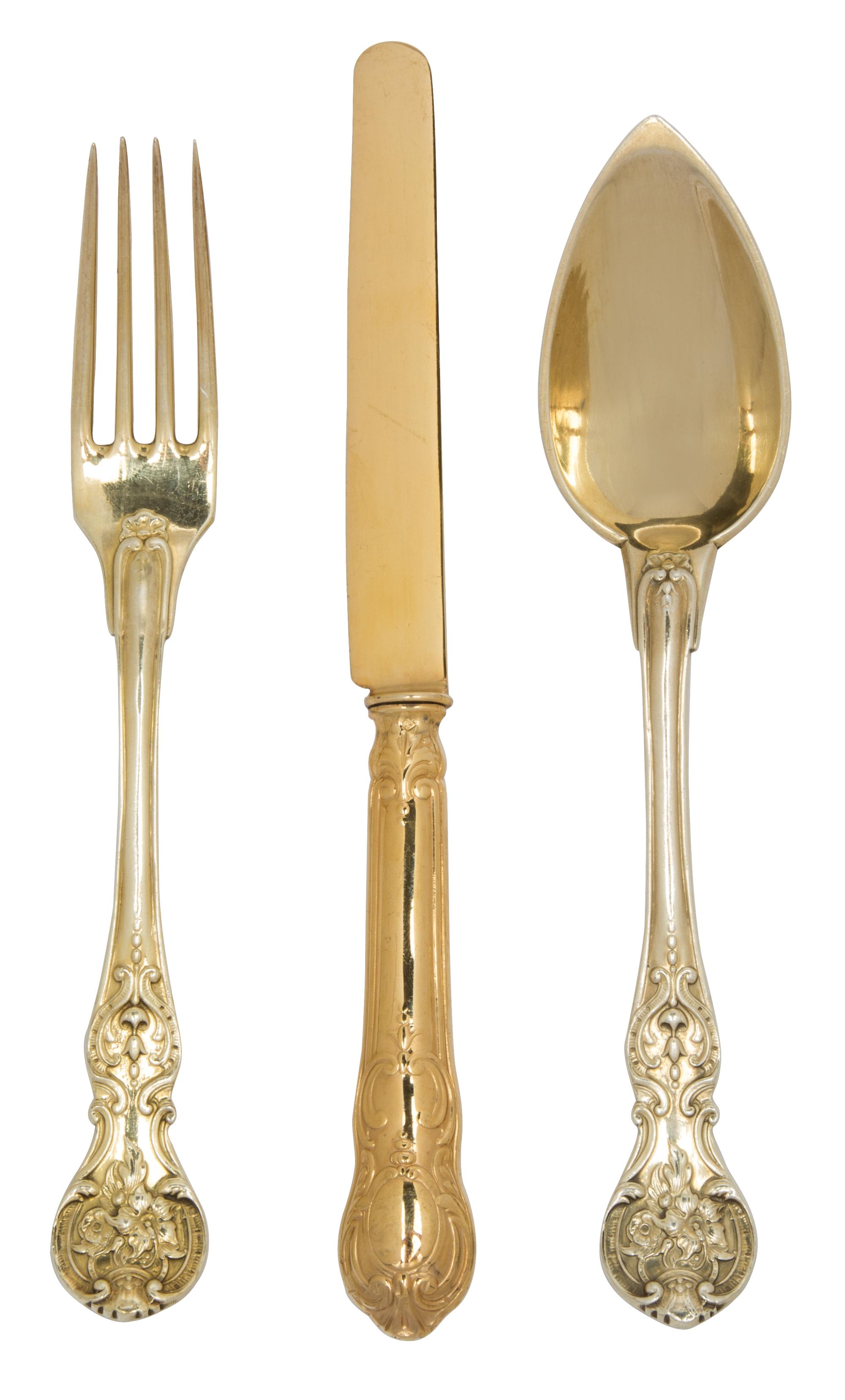 A Group of French Vermeil Silverplate Flatware, , comprising: 12 Christofle oval soup spoons 4 matching salad forks 18 fruit knives by