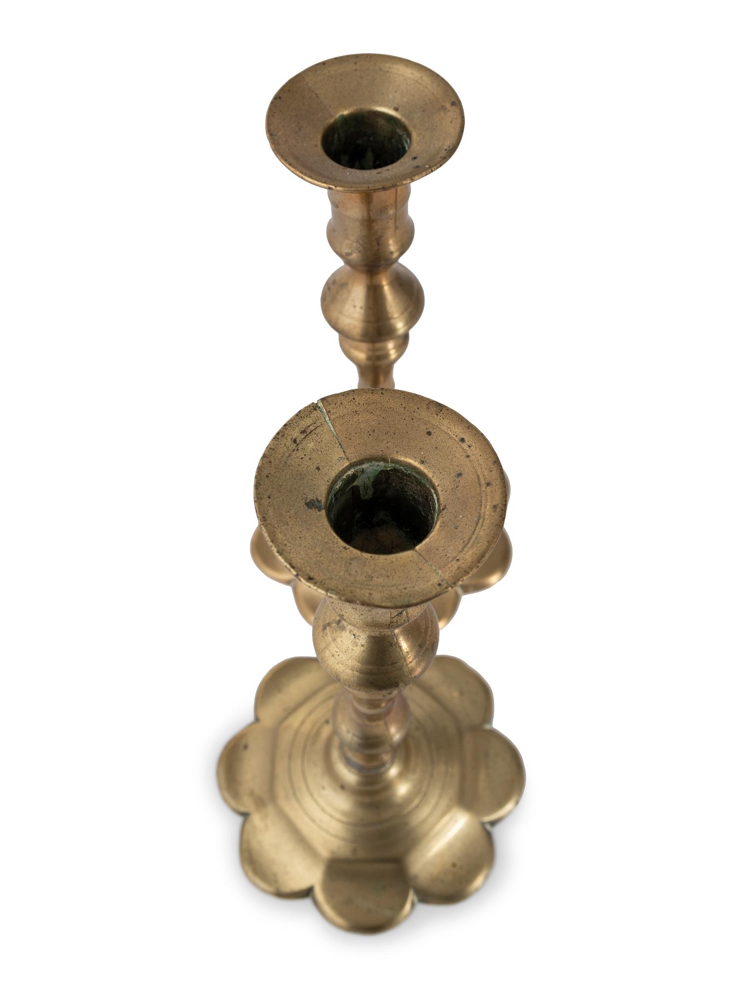 A Pair of English Brass Petal Base Candlesticks