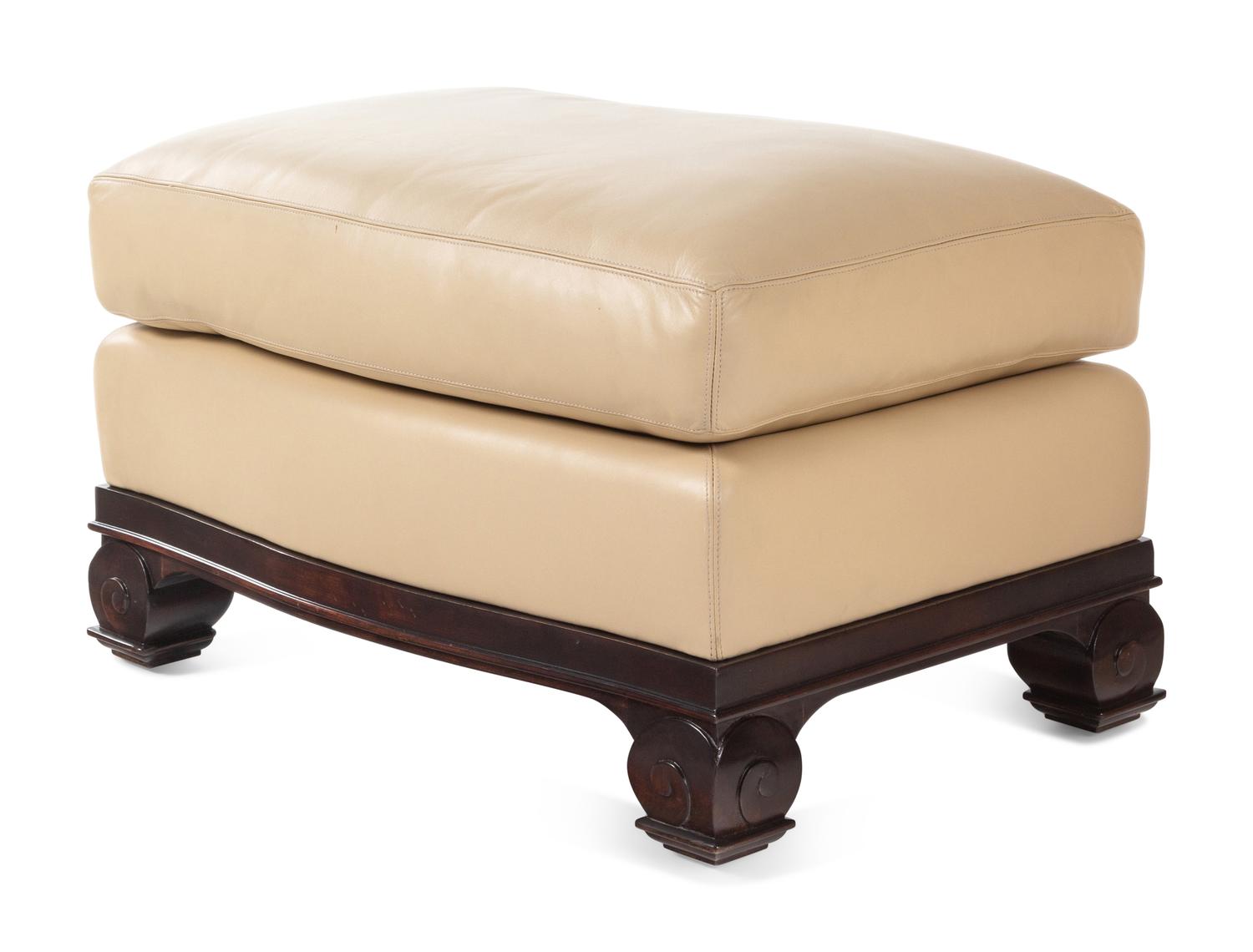 A Faux Leather Upholstered Lounge Chair and Ottoman