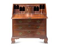 A Chippendale Carved Mahogany Serpentine-Front Slant-Front Desk