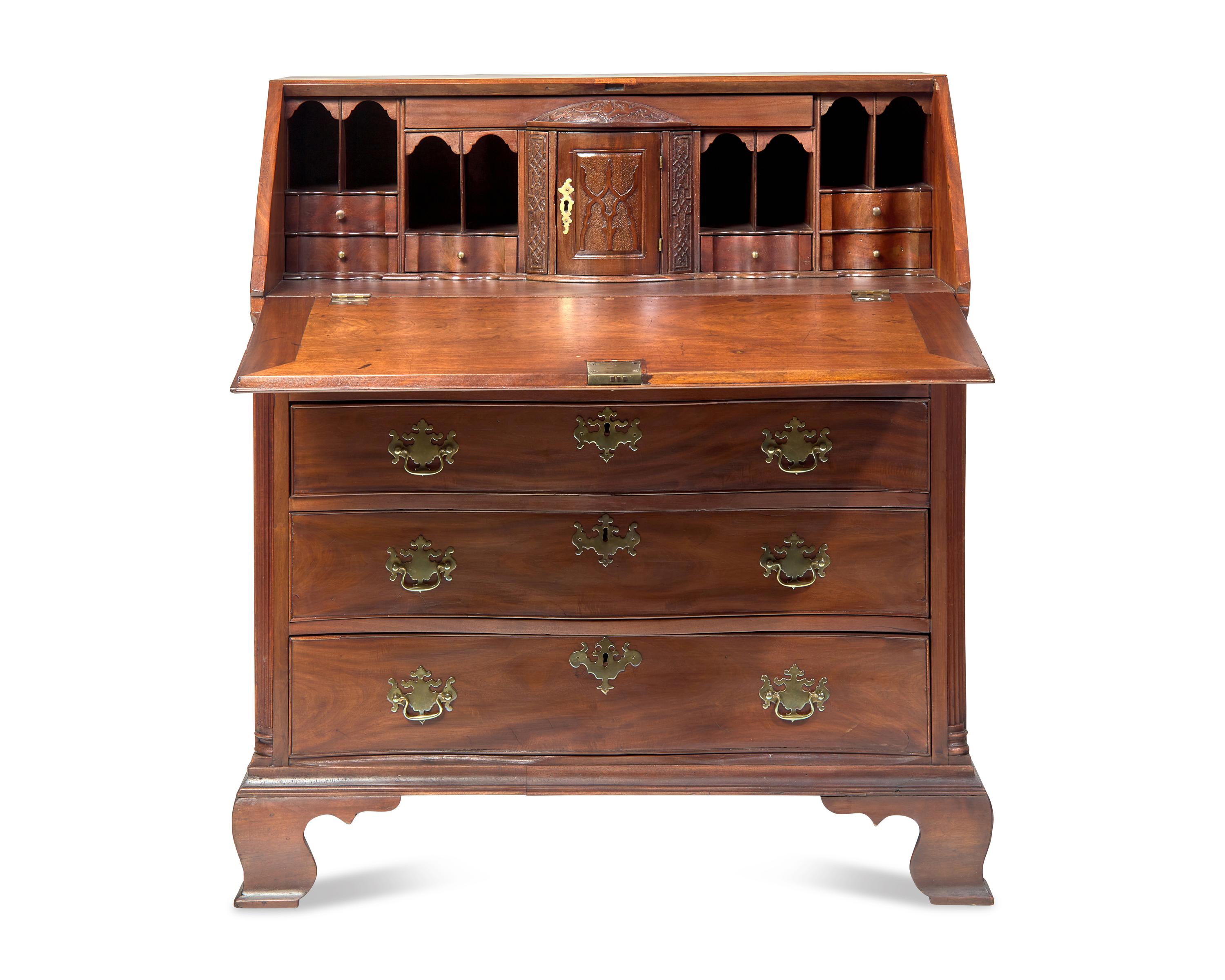 A Chippendale Carved Mahogany Serpentine-Front Slant-Front Desk