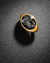 A Roman Black Jasper Intaglio with a Portrait Head of Socrates — Set in a gold ring