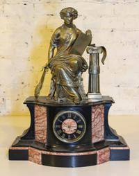 A Victorian Figural Mantel Clock. Height 22 inches.