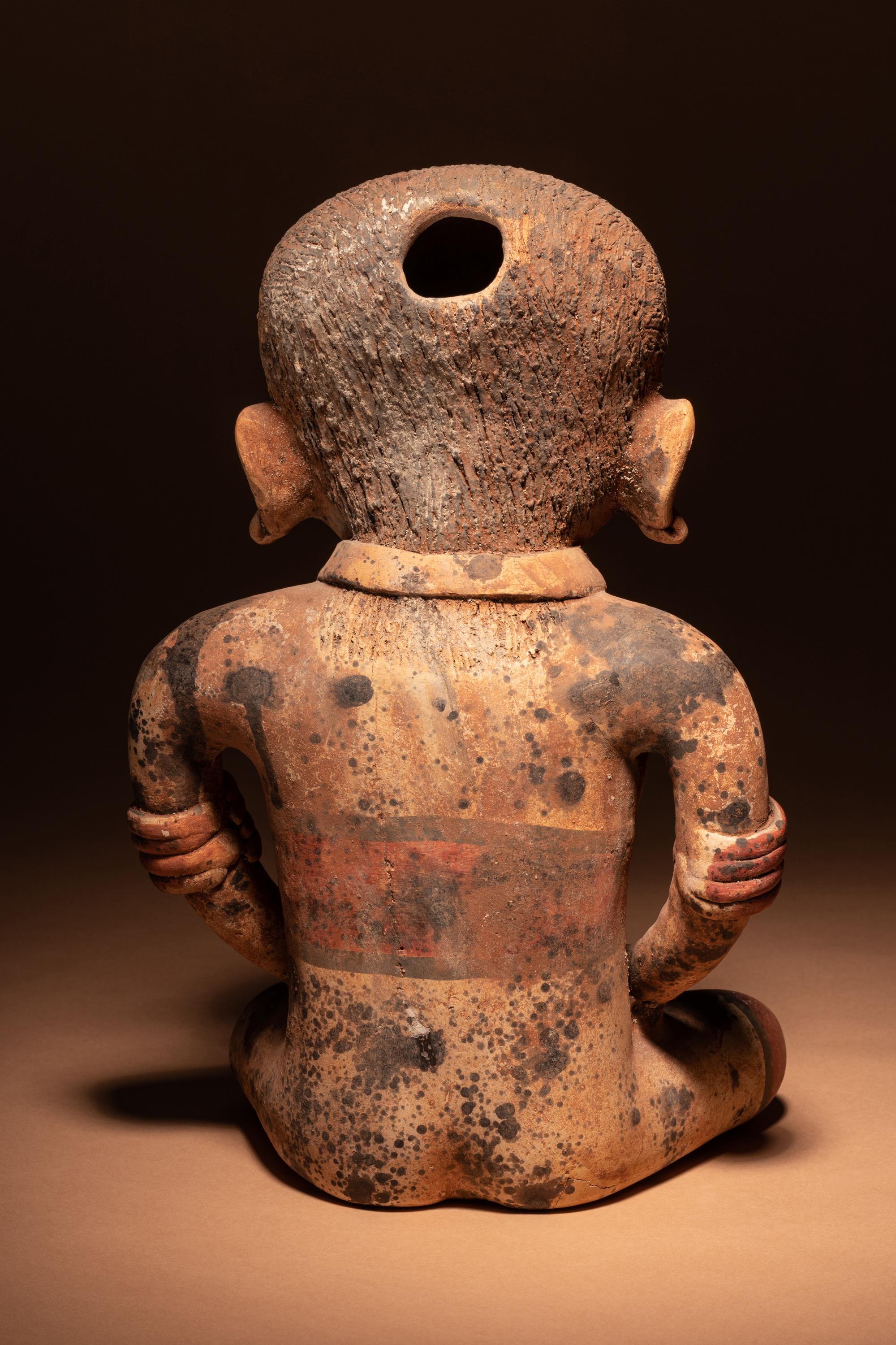 A Nayarit Terracotta Seated Female Figure