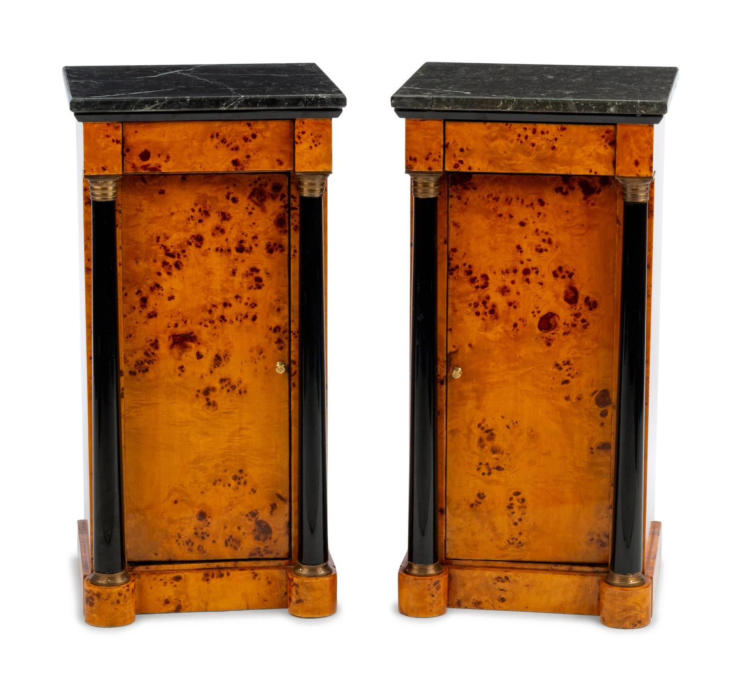 A Pair of Empire Style Parcel Ebonized Marble-Top Cabinets