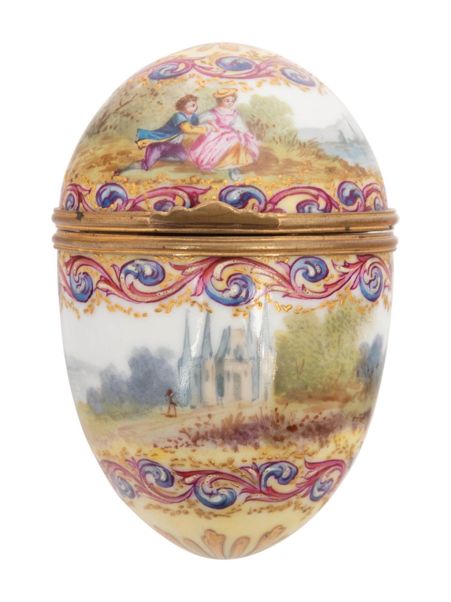 A Sèvres Style Painted Porcelain Egg-Form Bonbonnière