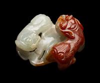 A Chinese Russet and Pale Celadon Jadeite Carving