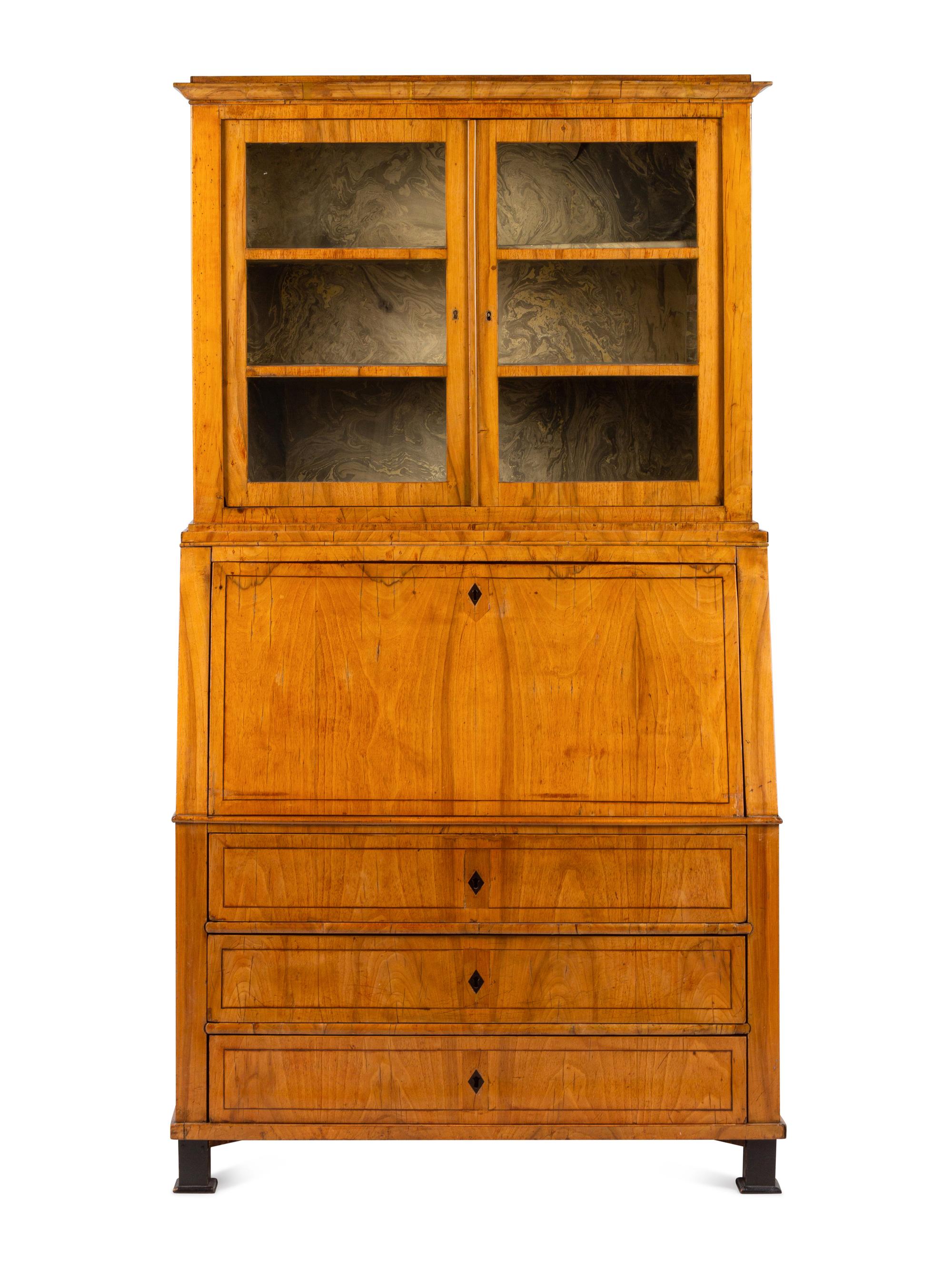 A Biedermeier Figured Walnut Secretary Bookcase