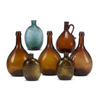 Group of colored blown-molded flasks, calabash and a whiskey jug various makers