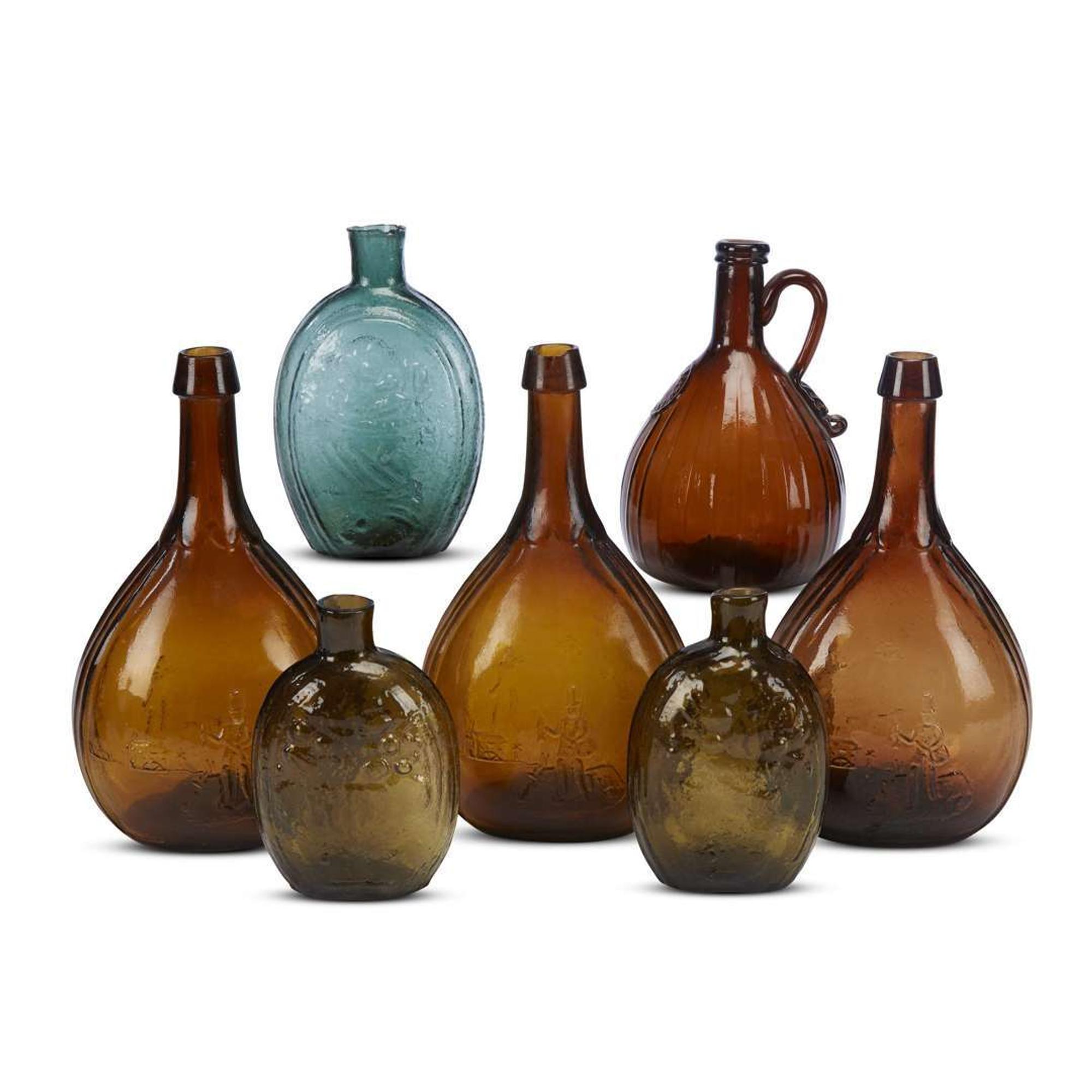 Group of colored blown-molded flasks, calabash and a whiskey jug various makers